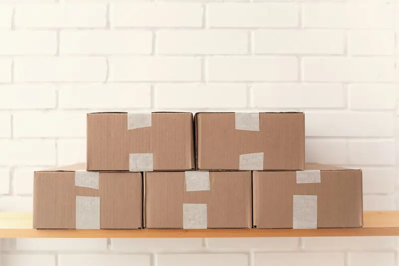 Sealed shipping boxes stacked on a shelf