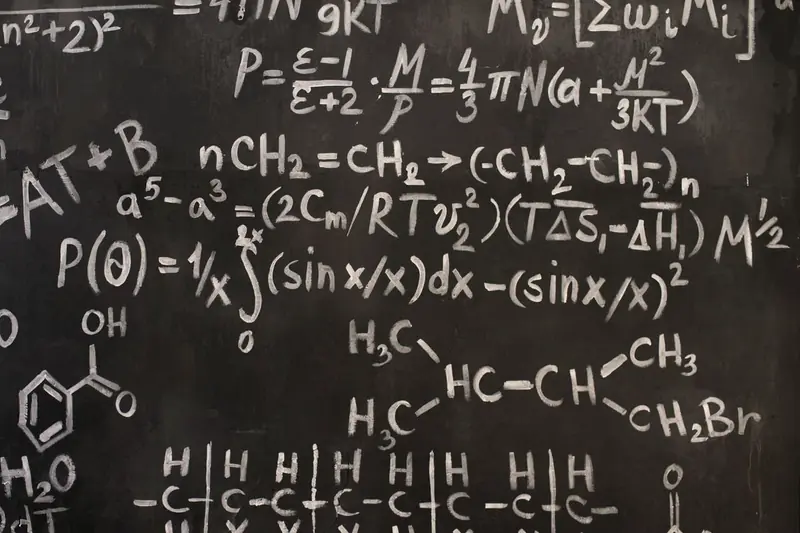 Equations written in chalk on a blackboard